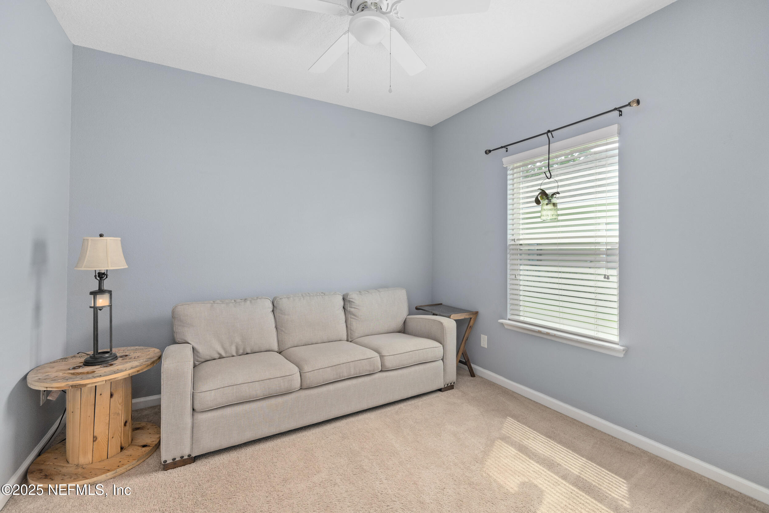 221 St Kitts Loop St. Augustine, FL 32092 - Photo 21 of 44 a living room with furniture and a window
