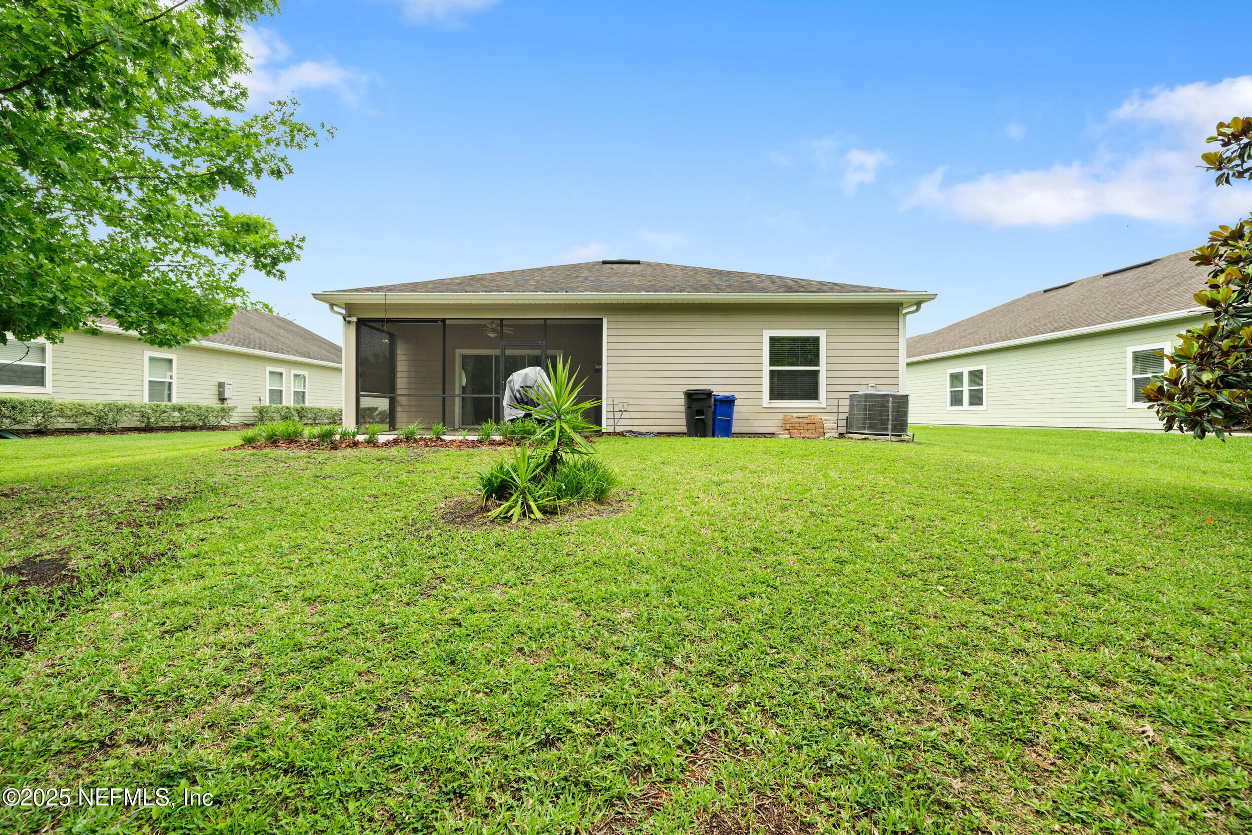 221 St Kitts Loop St. Augustine, FL 32092 - Photo 27 of 44 a view of a house with a yard