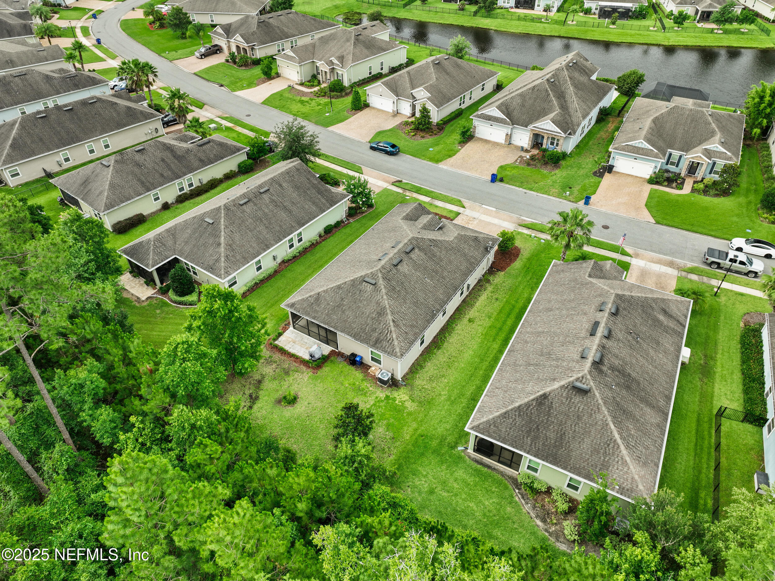 221 St Kitts Loop St. Augustine, FL 32092 - Photo 34 of 44 an aerial view of a house with a garden