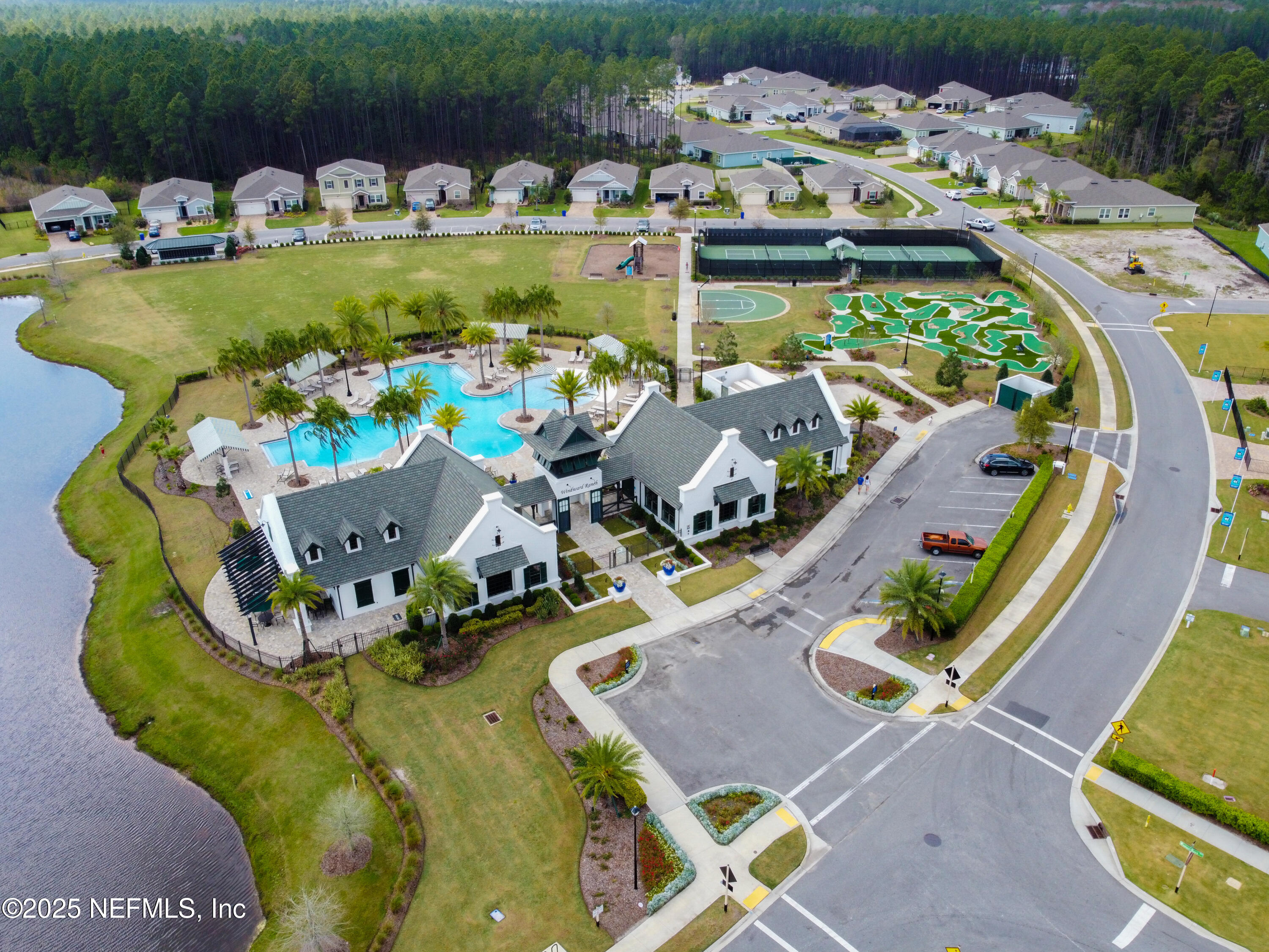 221 St Kitts Loop St. Augustine, FL 32092 - Photo 37 of 44 an aerial view of a swimming pool with outdoor seating