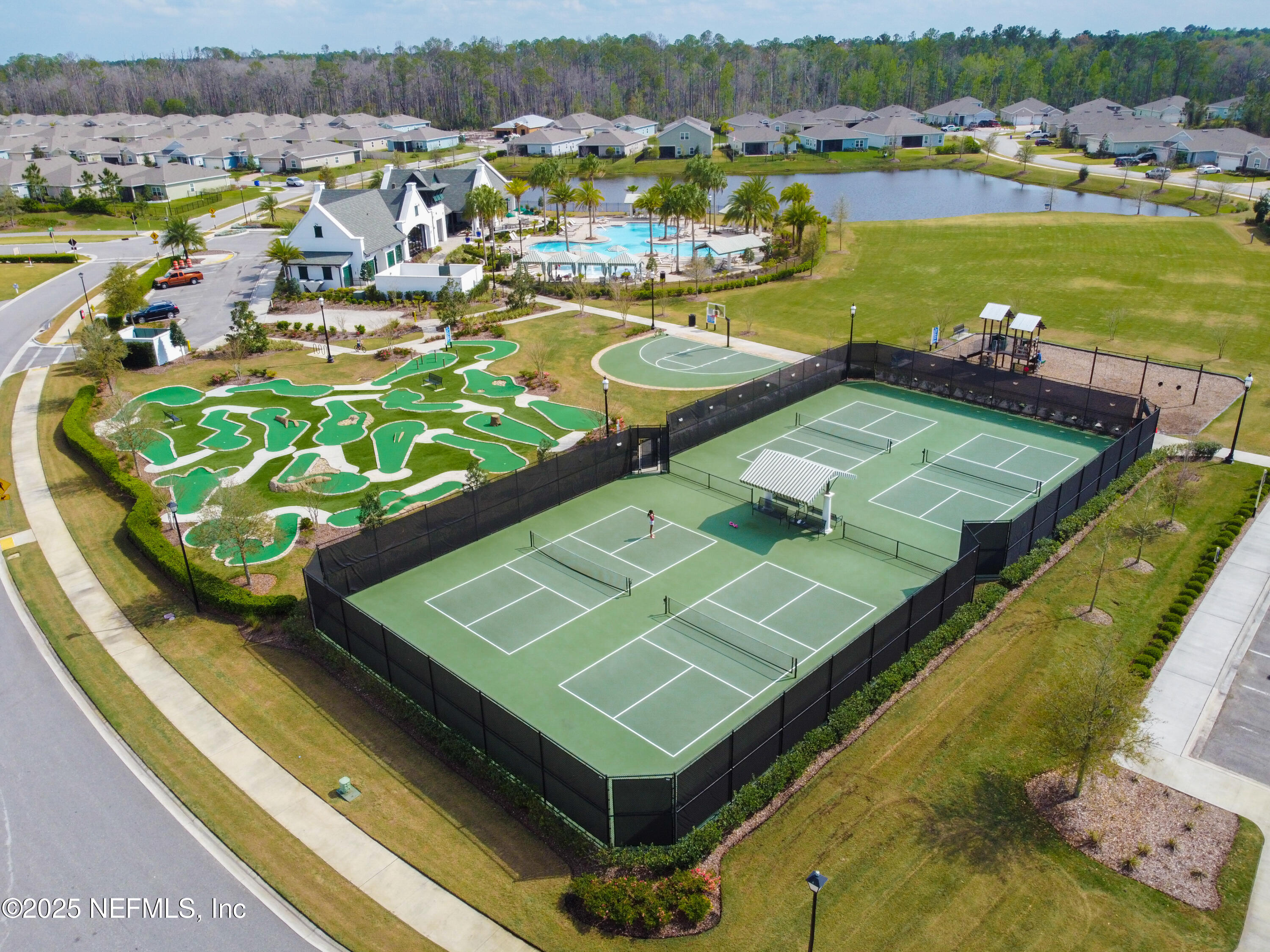 221 St Kitts Loop St. Augustine, FL 32092 - Photo 42 of 44 a view of a pool with a lake view