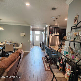 221 St Kitts Loop St. Augustine, FL 32092 - Photo 8 of 44 a living room with lots of furniture and a wooden floor