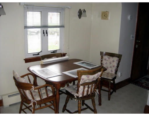 5 Shore Garden Road Hull, MA 02045 - Photo 3 of 14 a view of a dining room with furniture and window