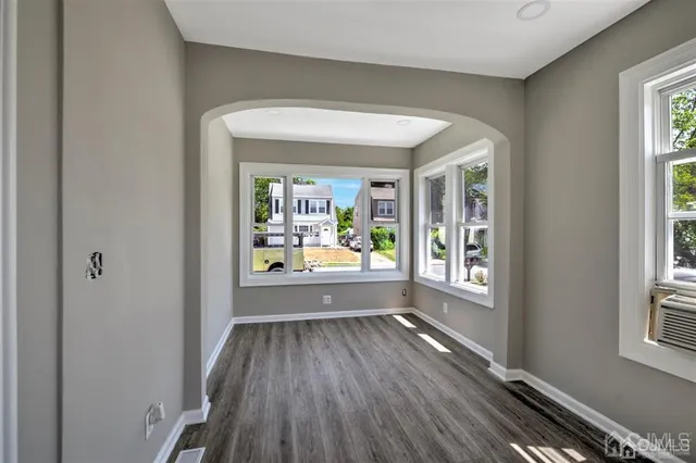 a view of entryway with wooden floor
