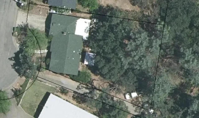 a view of a house and a yard