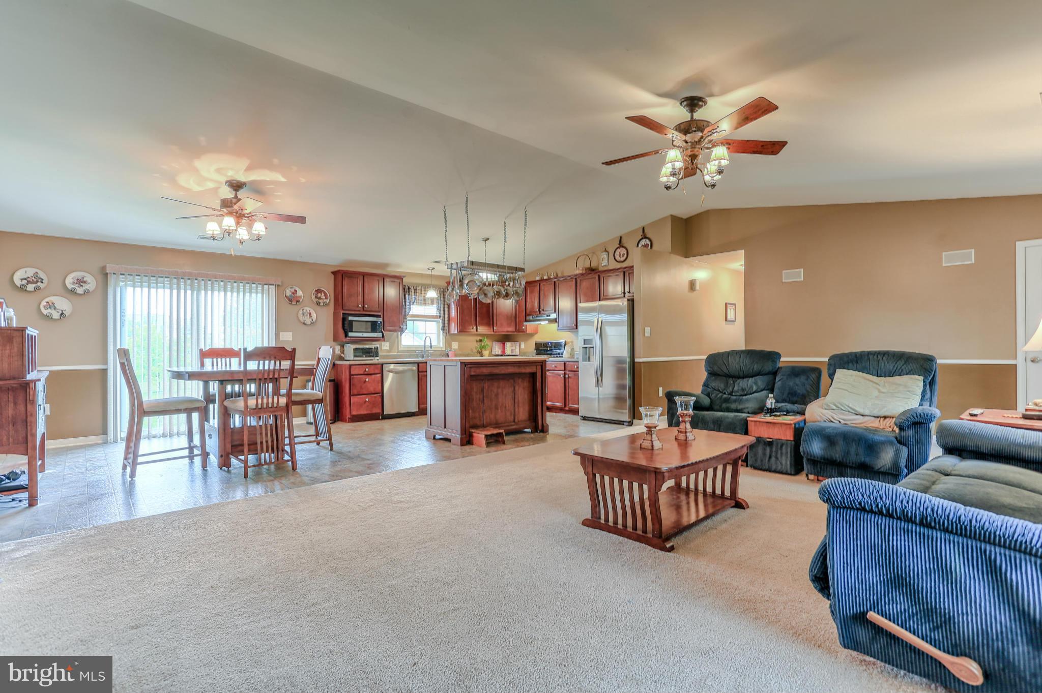 13048 Resh Road Hagerstown, MD 21740 - Photo 3 of 30 a living room with furniture and kitchen view