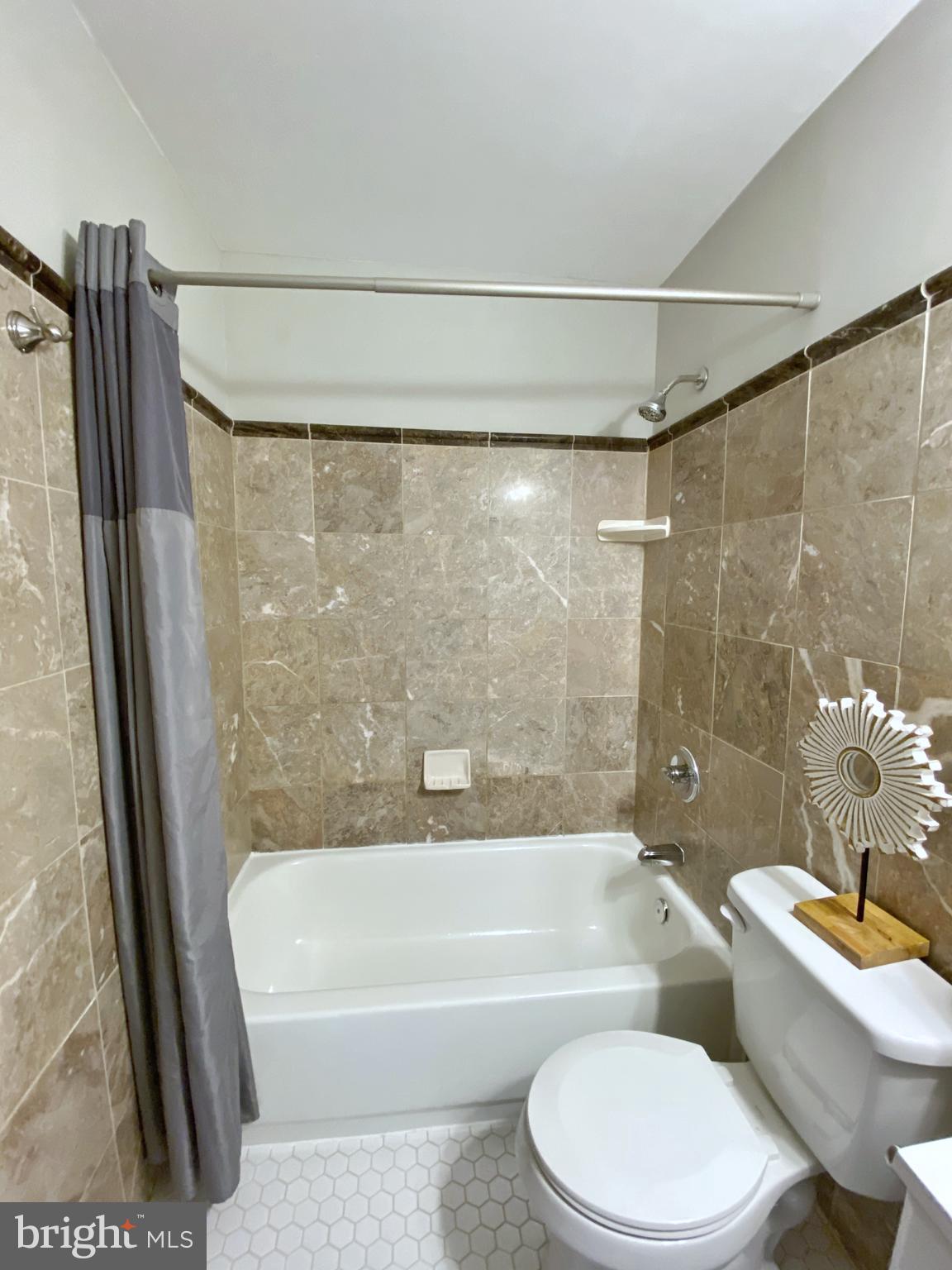 6101 Ridgeview Avenue Baltimore, MD 21206 - Photo 18 of 36 Hall Bath with custom tile