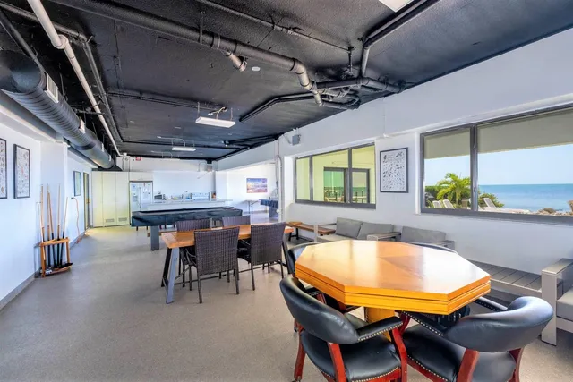 a view of a swimming pool with chairs