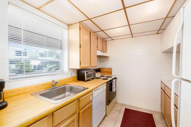 a view of a dining room with furniture and window