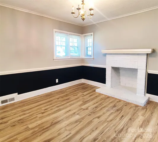 a bedroom with a bed and a fireplace