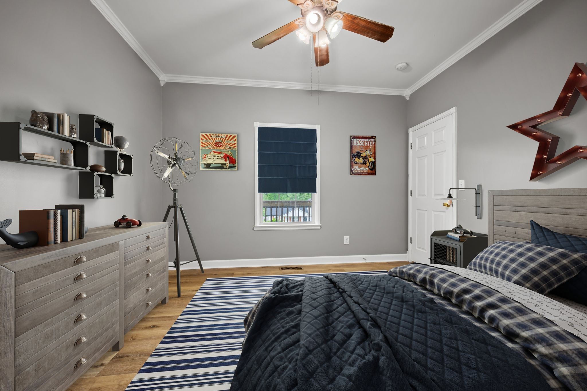 830 Blakemore Road Dickson, TN 37055 - Photo 15 of 22 a bedroom with a bed and a chandelier