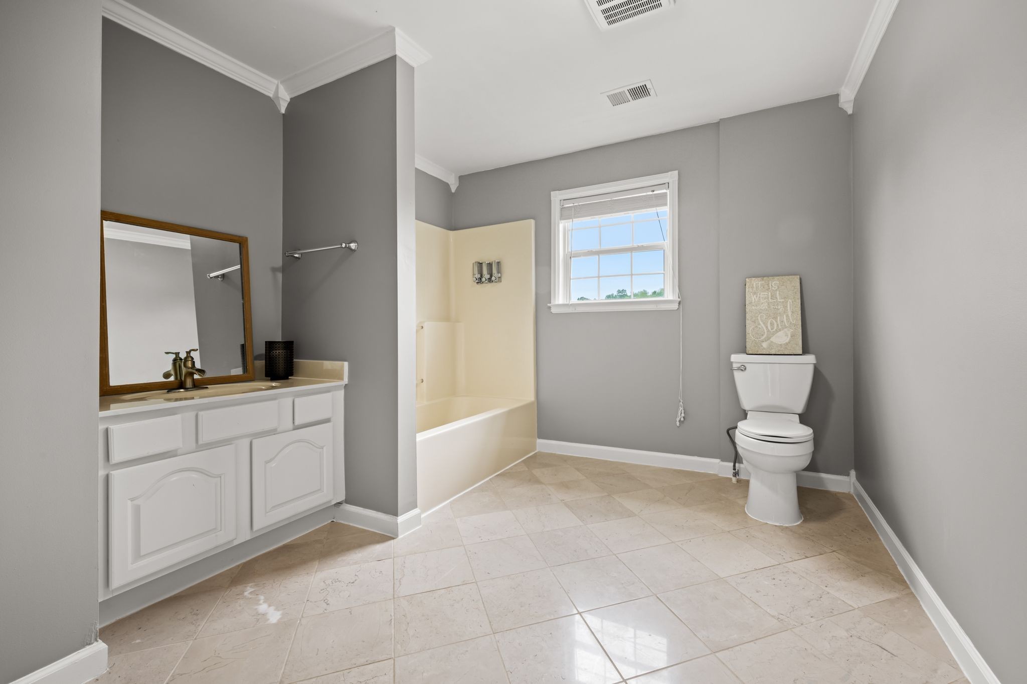 830 Blakemore Road Dickson, TN 37055 - Photo 17 of 22 a bathroom with a toilet a sink and mirror