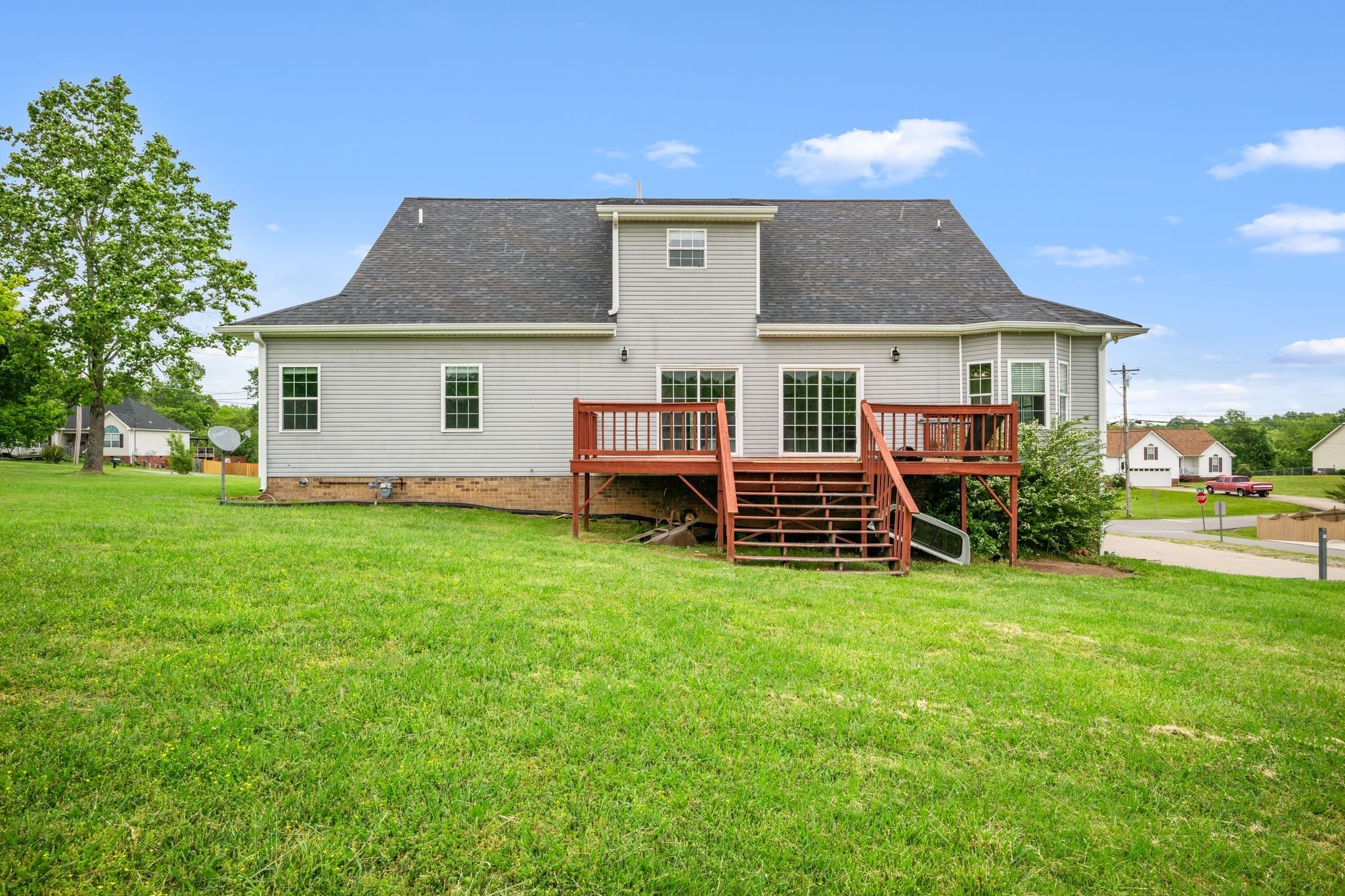 830 Blakemore Road Dickson, TN 37055 - Photo 21 of 22 a backyard of a house with table and chairs