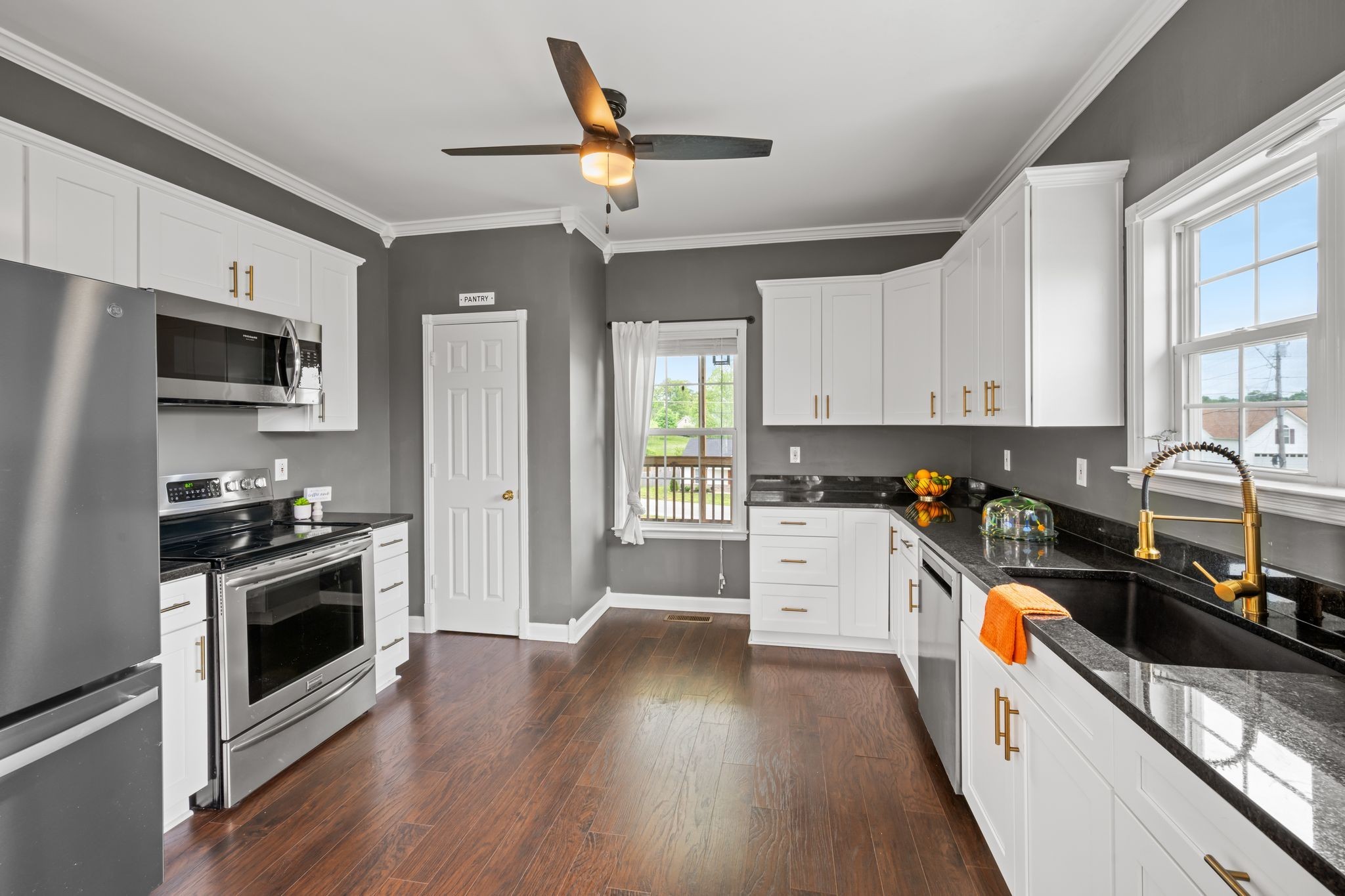 830 Blakemore Road Dickson, TN 37055 - Photo 10 of 22 a kitchen with granite countertop a stove a sink dishwasher a refrigerator cabinets and wooden floor
