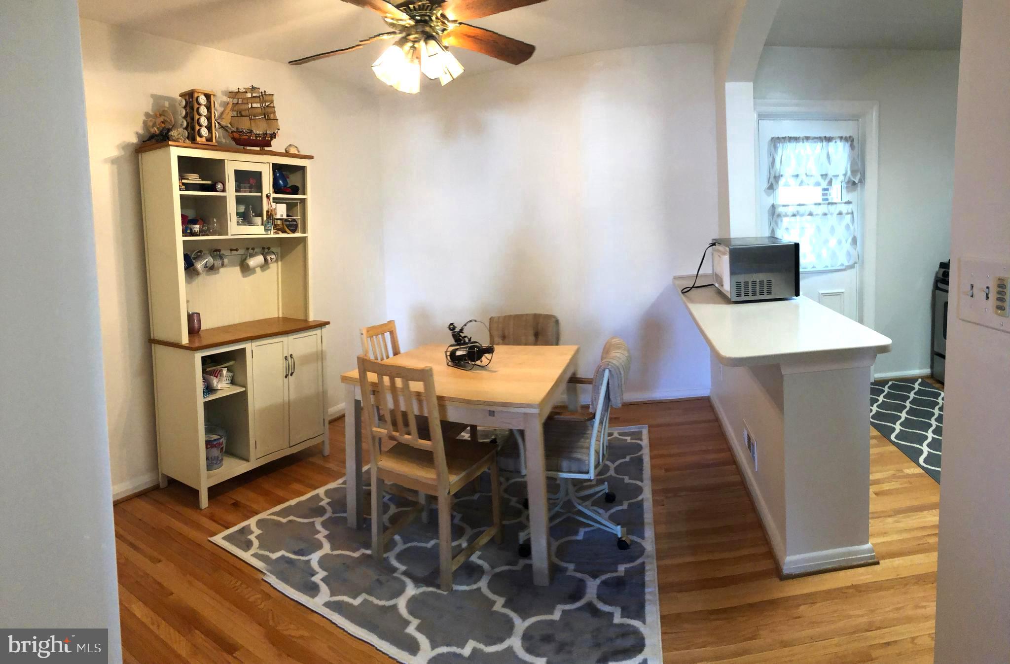7317 Conley Street Baltimore, MD 21224 - Photo 6 of 19 Dining Room with Breakfast Bar