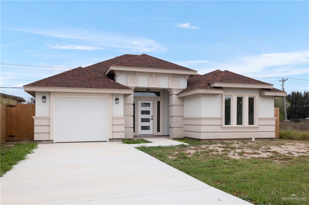 6050 Reymundo Street Edinburg, TX 78542 - Photo 1 of 11 a front view of a house with a yard