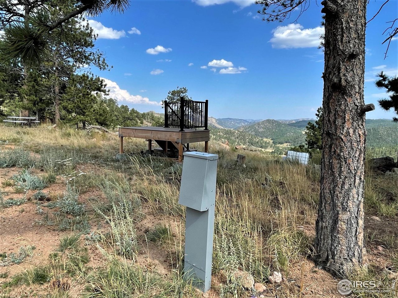 1230 Caddo Road Red Feather Lakes, CO 80545 - Photo 17 of 38 RV pedestal with both 30- & 50-amp hookups. Deck is also included.