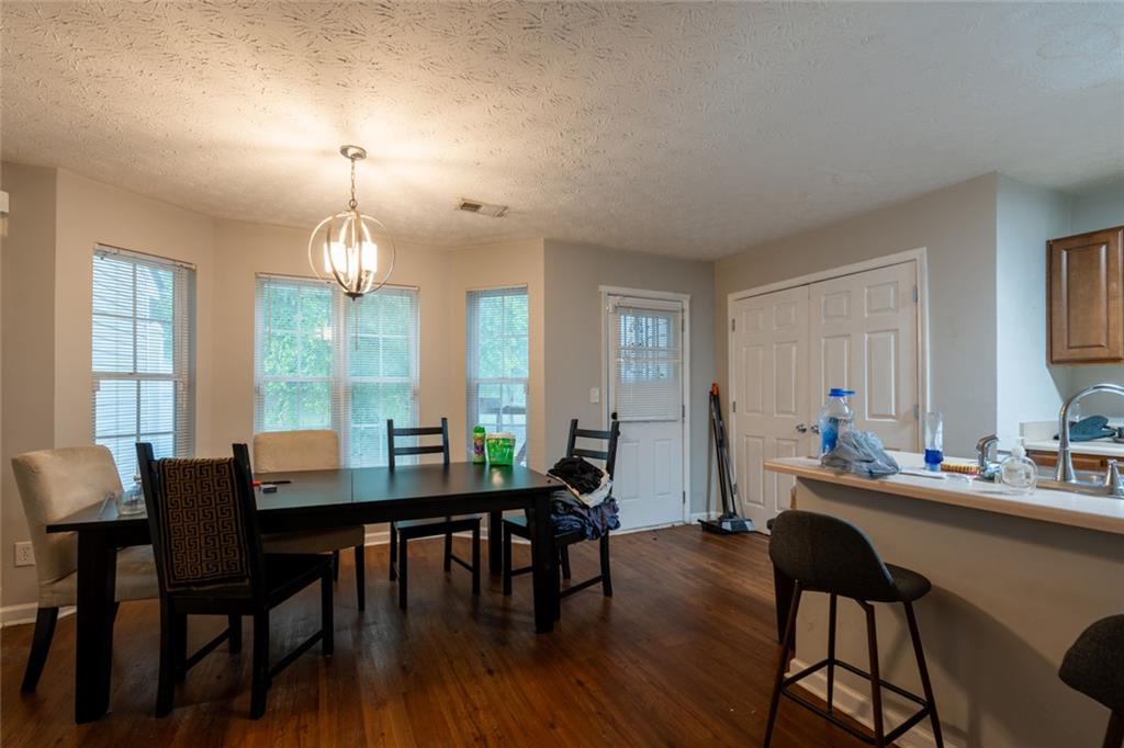 3474 Waldrop Trail Decatur, GA 30034 - Photo 5 of 17 a view of a dining room with furniture and wooden floor