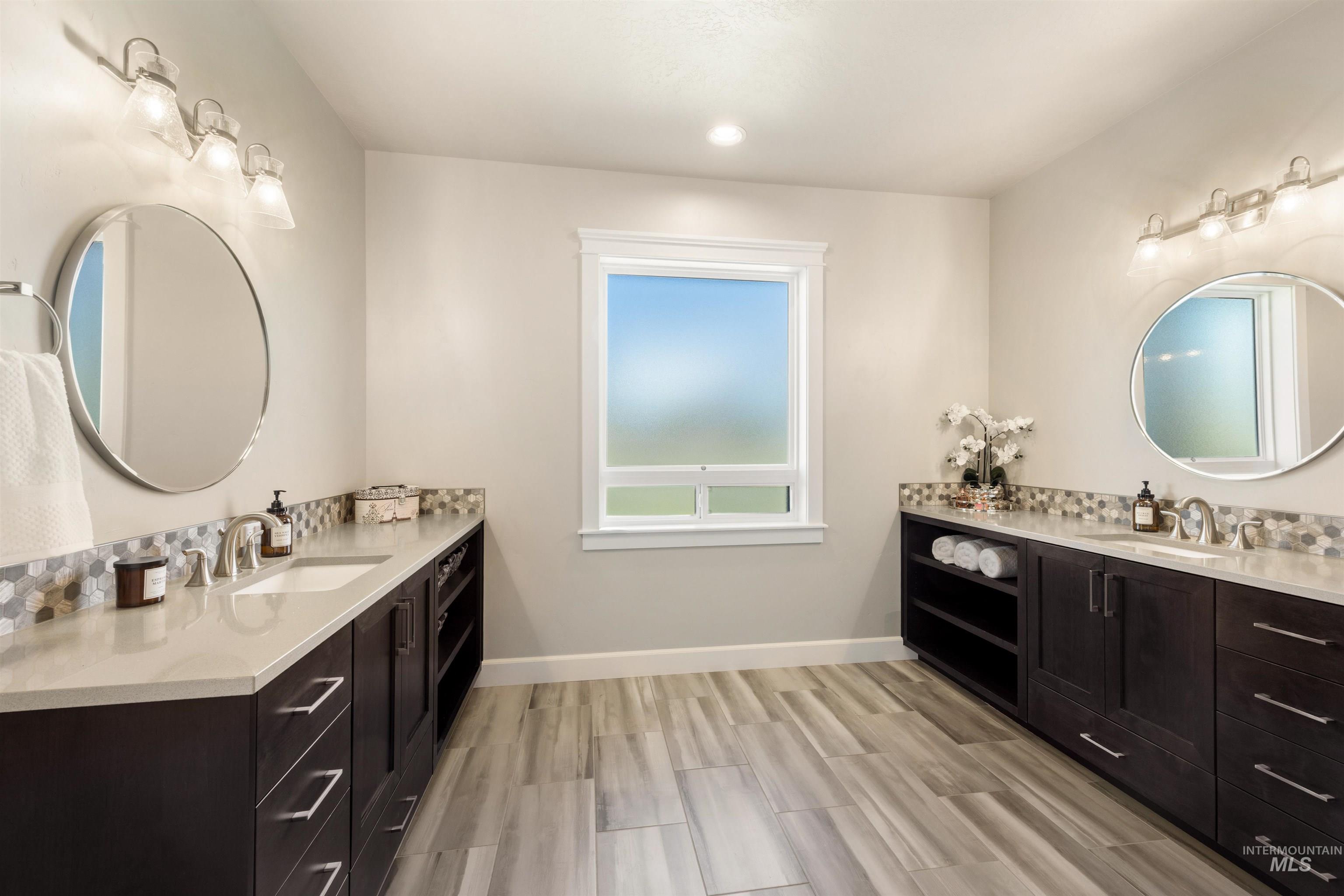 15465 Syrah Court Caldwell, ID 83607 - Photo 22 of 45 Full bathroom featuring two vanities and wood tiled floors