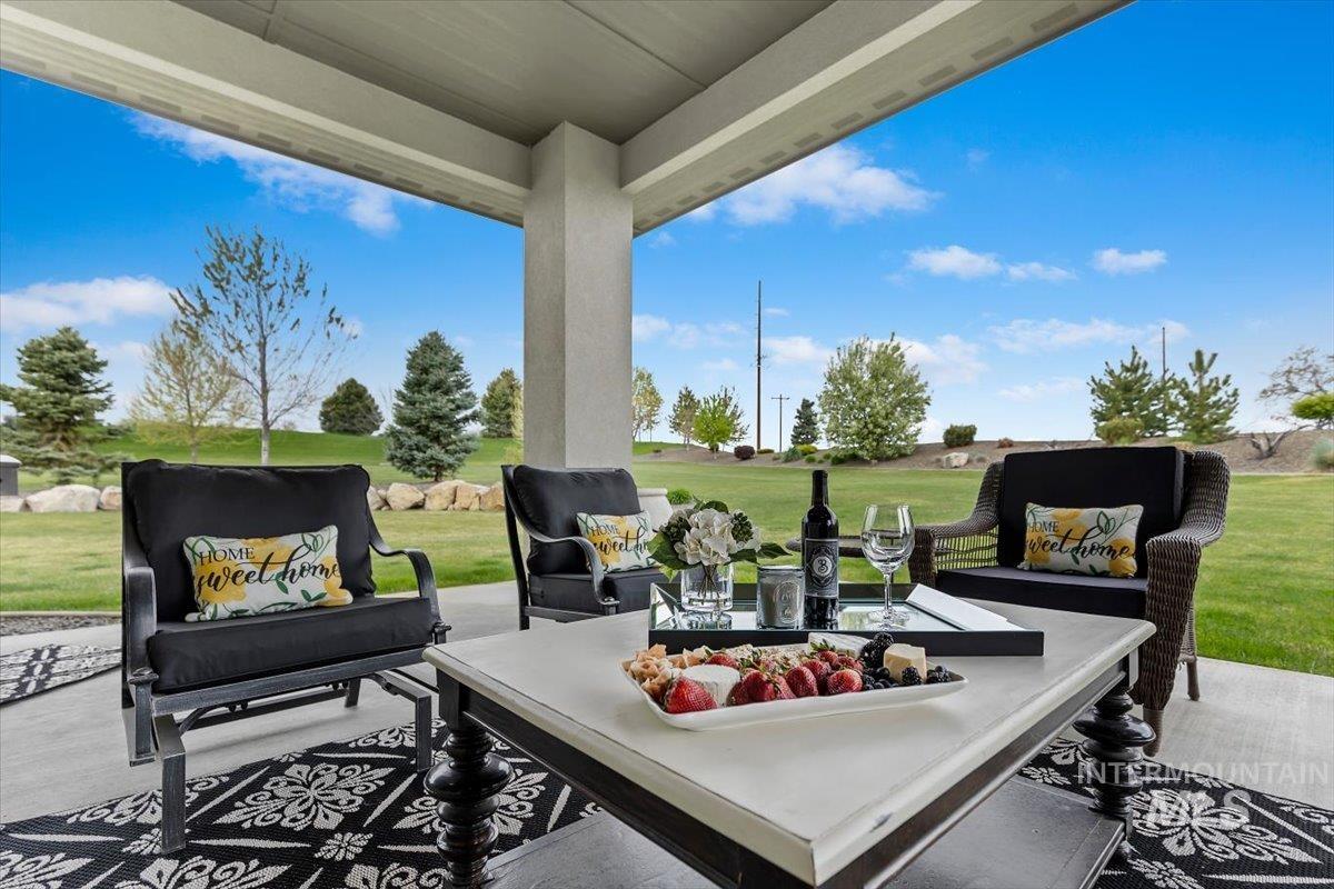 15465 Syrah Court Caldwell, ID 83607 - Photo 33 of 45 View of patio / terrace with an outdoor hangout area and view of golf course