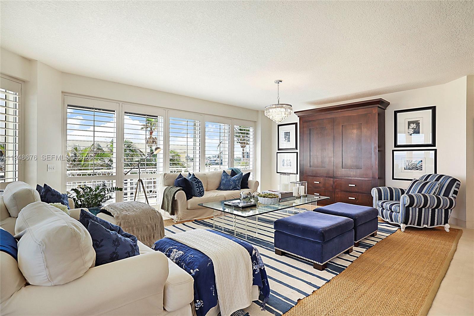 19950 South Beach Road, Unit 4S Jupiter, FL 33469 - Photo 21 of 56 a living room with furniture and a large window