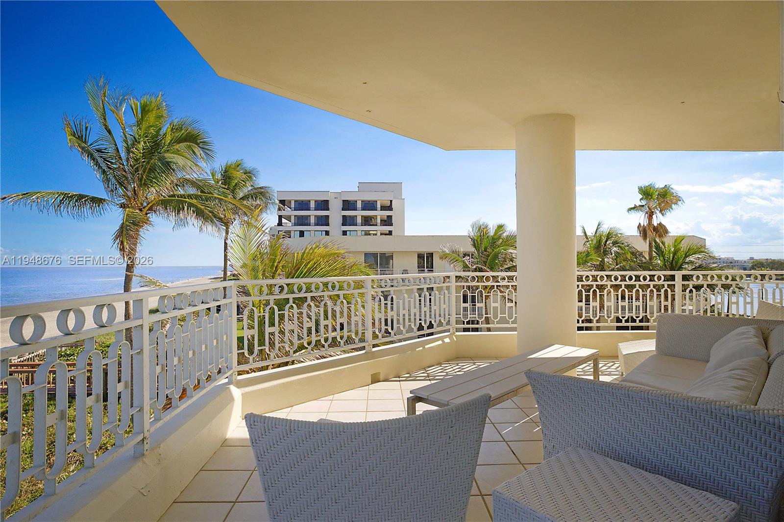 19950 South Beach Road, Unit 4S Jupiter, FL 33469 - Photo 33 of 56 a balcony with furniture and a potted plant