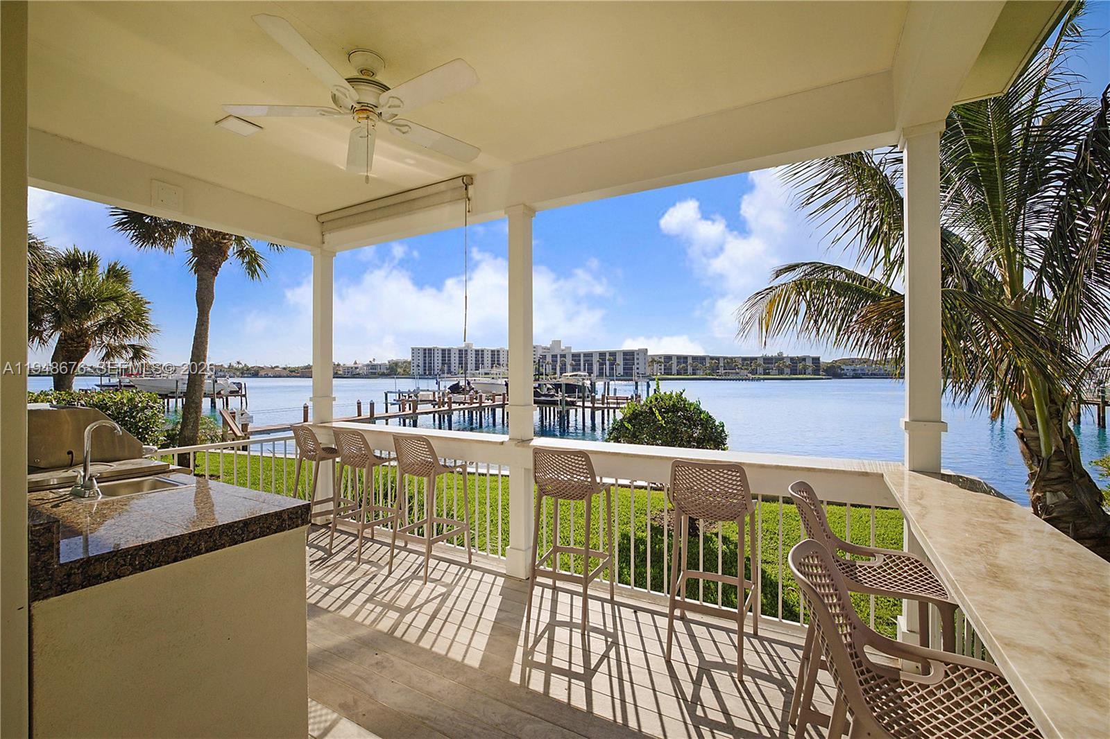 19950 South Beach Road, Unit 4S Jupiter, FL 33469 - Photo 47 of 56 a view of a balcony with furniture