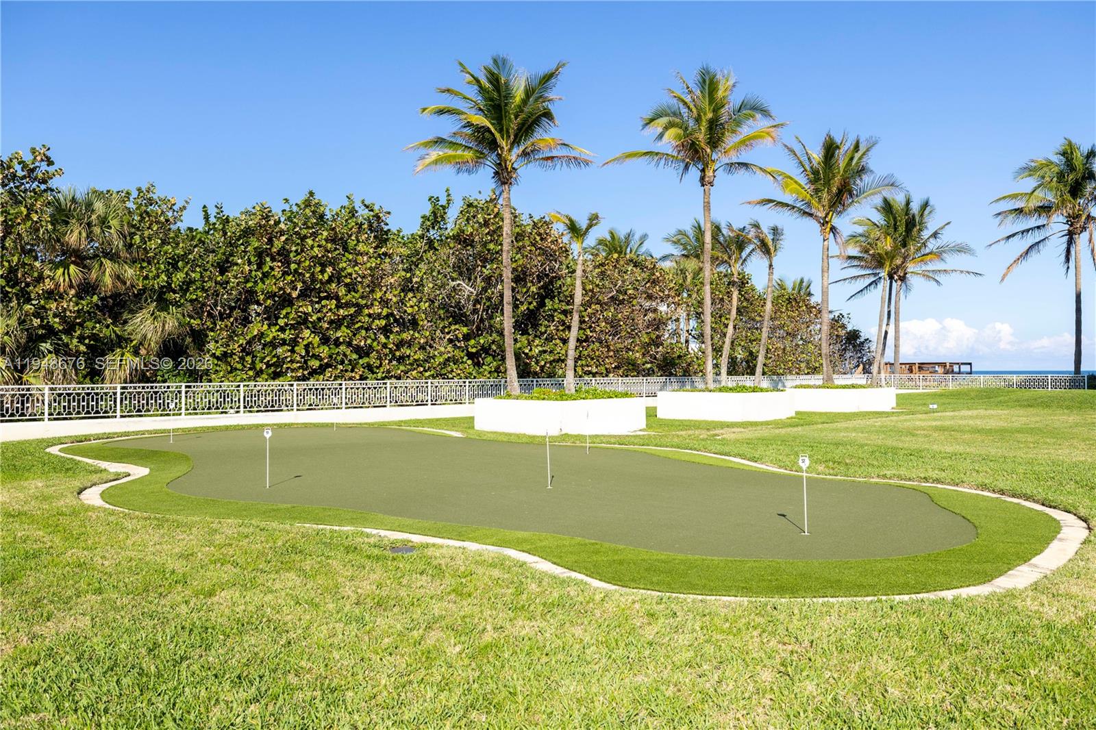 19950 South Beach Road, Unit 4S Jupiter, FL 33469 - Photo 50 of 56 a view of a swimming pool with a yard