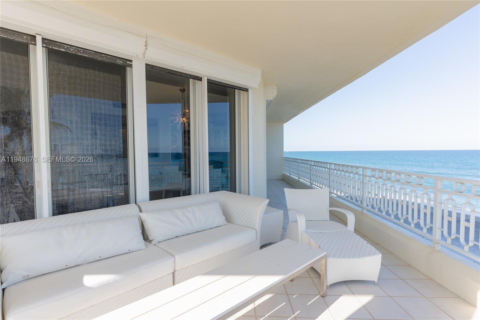 19950 South Beach Road, Unit 4S Jupiter, FL 33469 - Photo 7 of 56 a balcony with furniture and city view