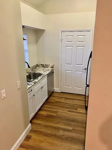 a kitchen with stainless steel appliances granite countertop a stove and a refrigerator