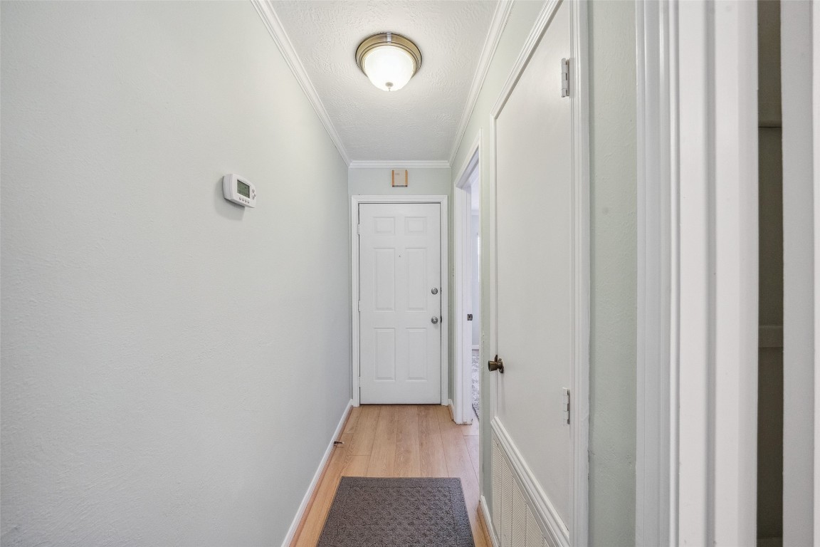801 River Road, Unit F120 Montgomery, TX 77356 - Photo 13 of 18 a view of a hallway with wooden floor and staircase