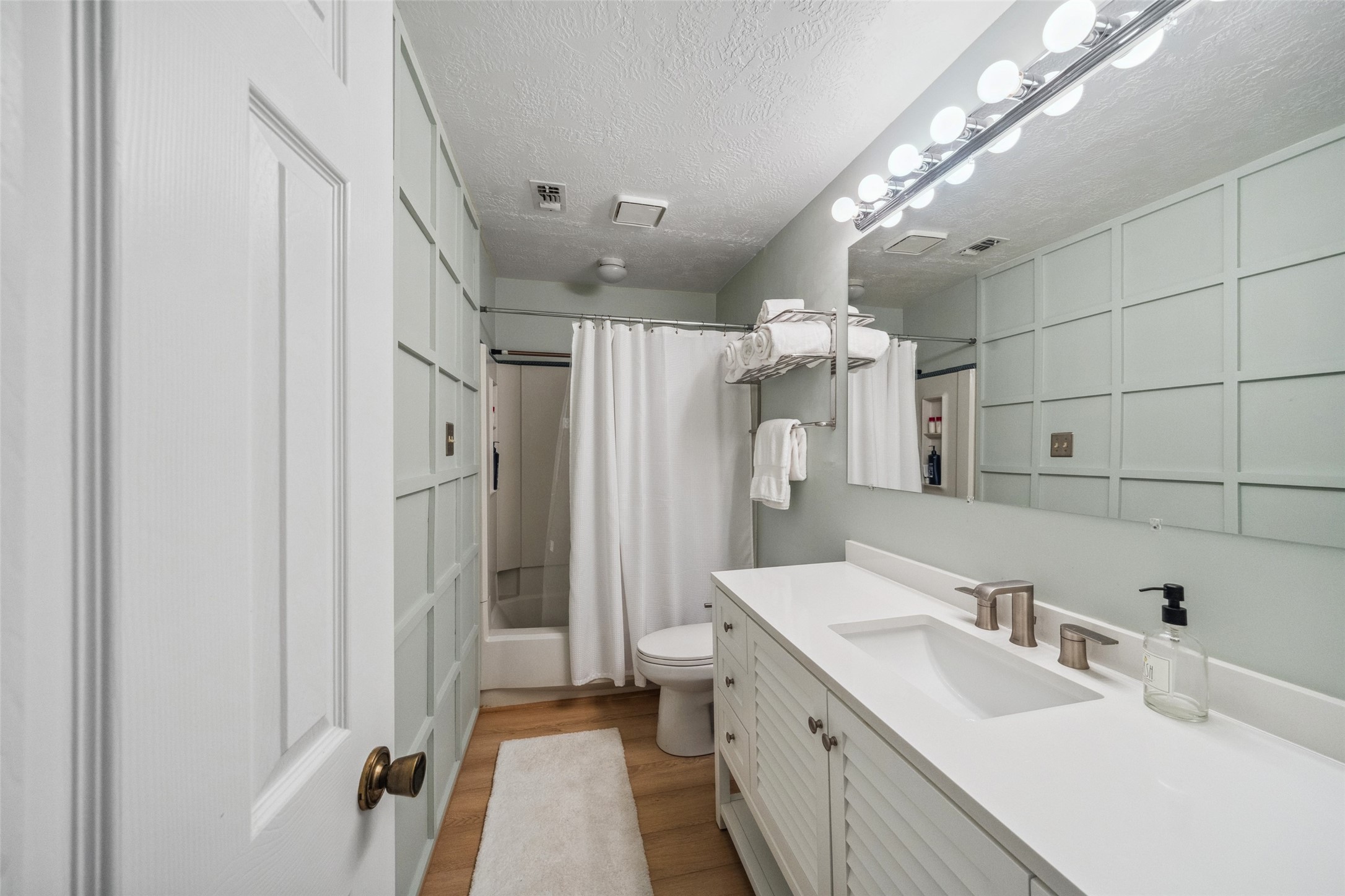 801 River Road, Unit F120 Montgomery, TX 77356 - Photo 14 of 18 Elevated styling in your Bath -- Shower/Tub Combo, Updated Vanity for additional storage. Quartz Countertops, neutral tones and designer wall accents are just a few of the updates already made for you! 801 River Rd#F120, Montgomery, Texas