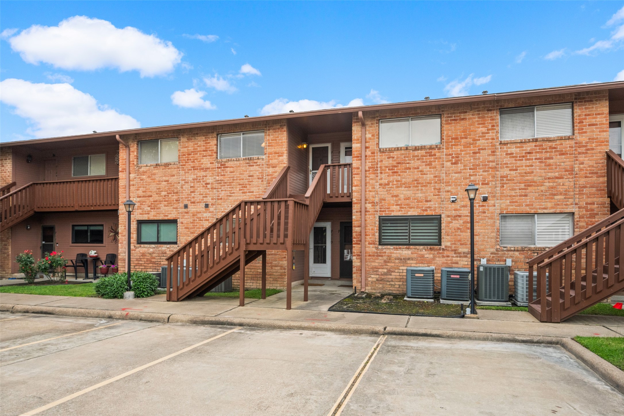 801 River Road, Unit F120 Montgomery, TX 77356 - Photo 17 of 18 F120 Upstairs Unit faces central interior parking. 1 parking space in interior section unassigned; 1 parking space in exterior section, unassigned. 801 River Rd #F120, Montgomery, TX.