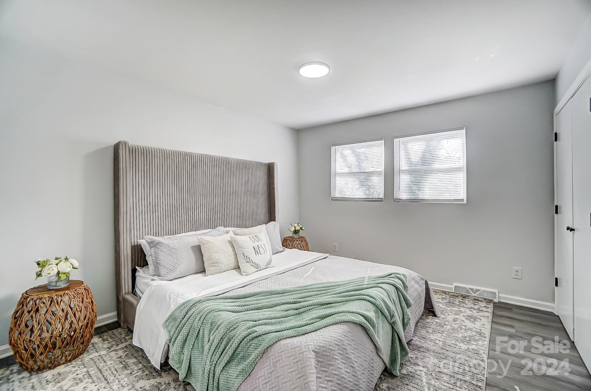 6524 Eaglecrest Road Charlotte, NC 28212 - Photo 19 of 48 a bedroom with a bed and wooden floor