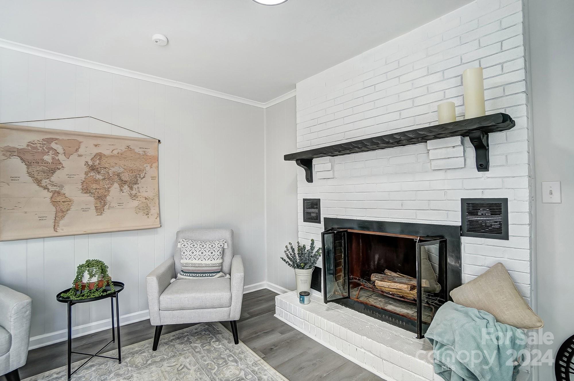 6524 Eaglecrest Road Charlotte, NC 28212 - Photo 28 of 48 a living room with furniture and a fireplace