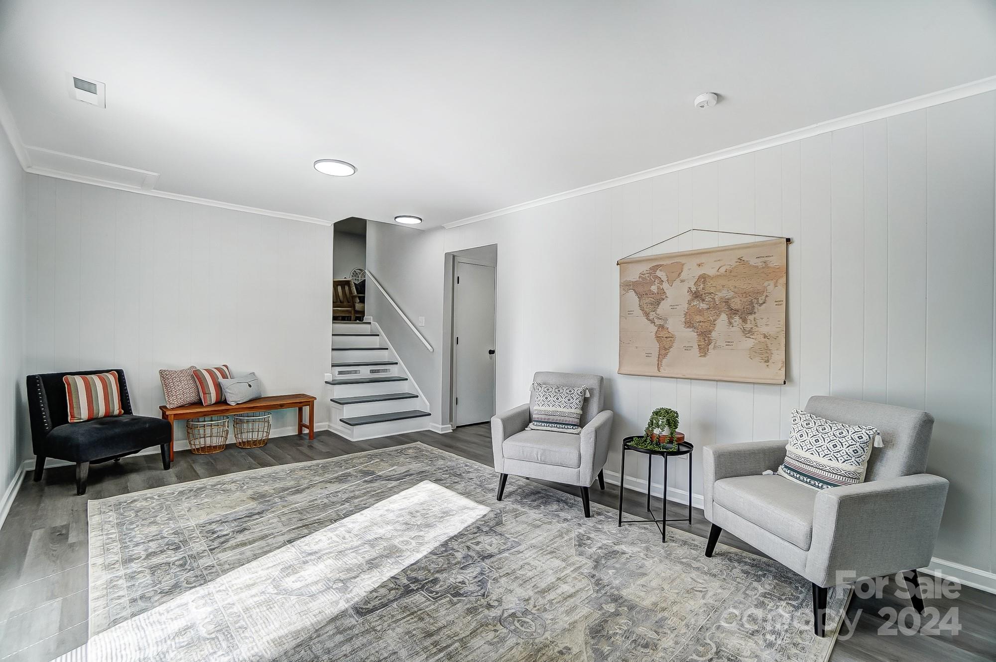 6524 Eaglecrest Road Charlotte, NC 28212 - Photo 29 of 48 a living room with furniture and a wooden floor