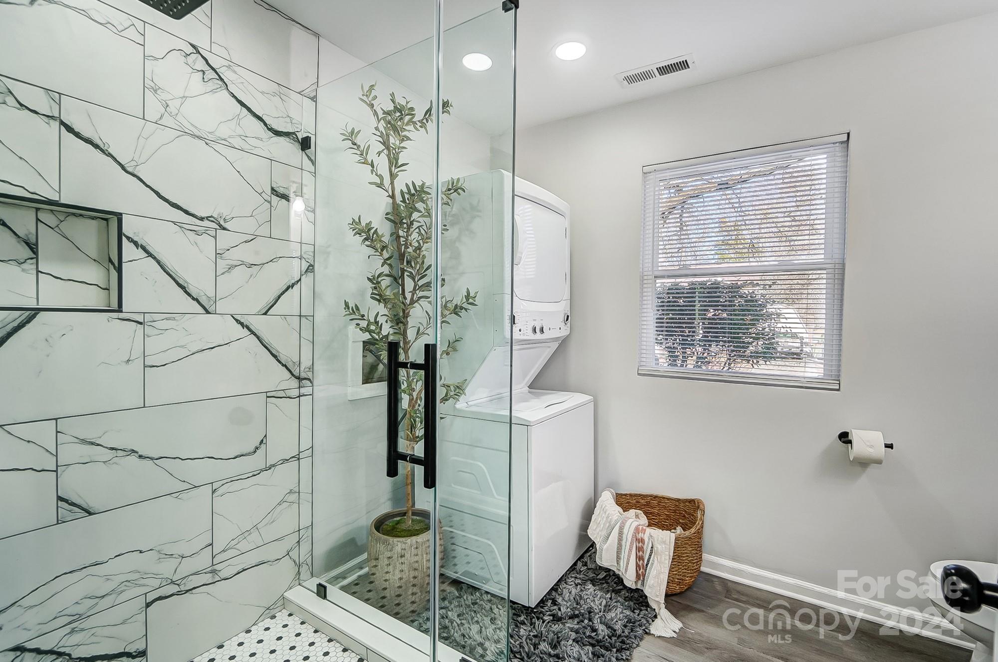 6524 Eaglecrest Road Charlotte, NC 28212 - Photo 35 of 48 a bathroom with a toilet and shower