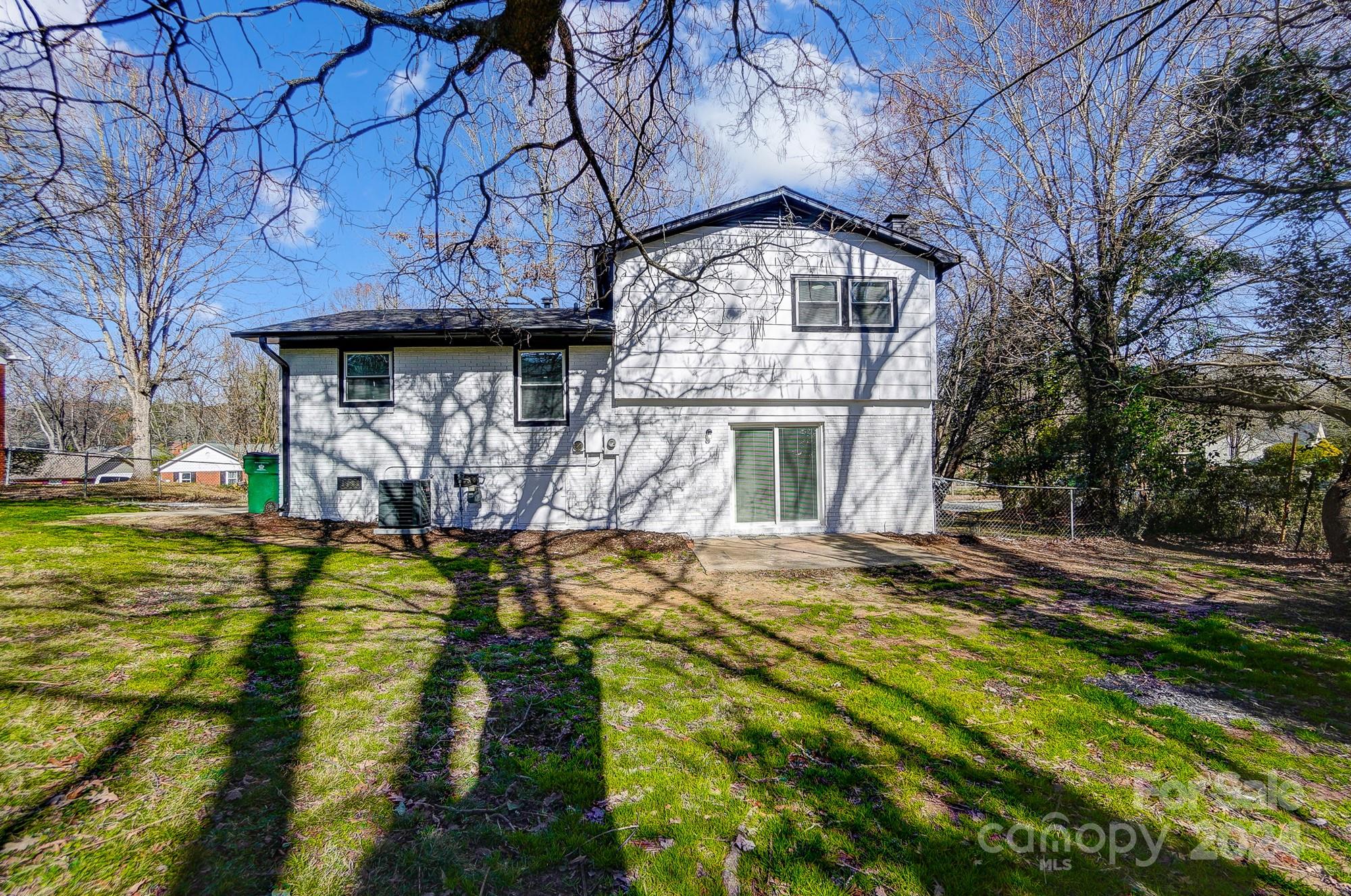 6524 Eaglecrest Road Charlotte, NC 28212 - Photo 45 of 48 a view of a house with a big yard and large tree
