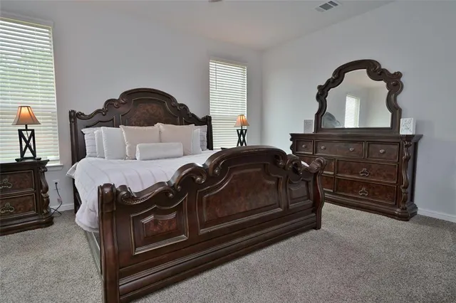 a bedroom with a bed and a fireplace