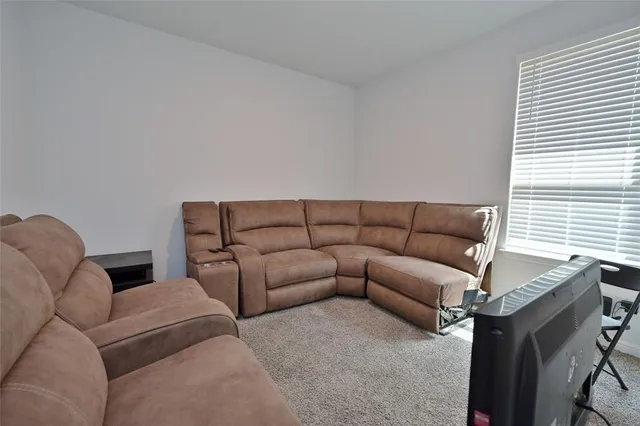 a living room with furniture and a couch