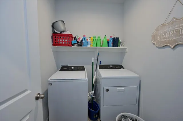 a utility room with dryer and washer