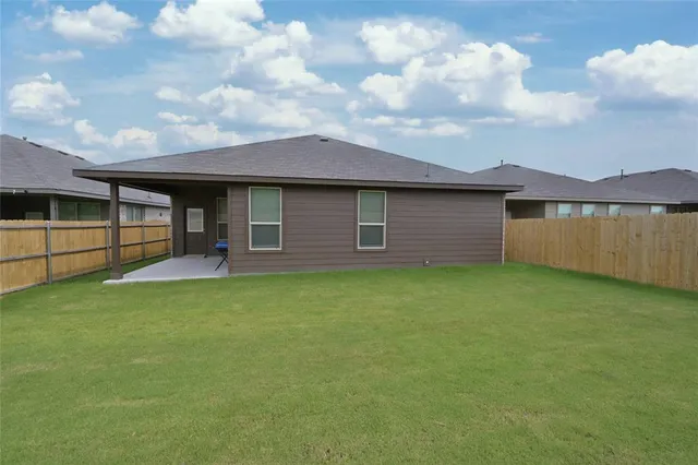 a backyard of a house with lots of green space