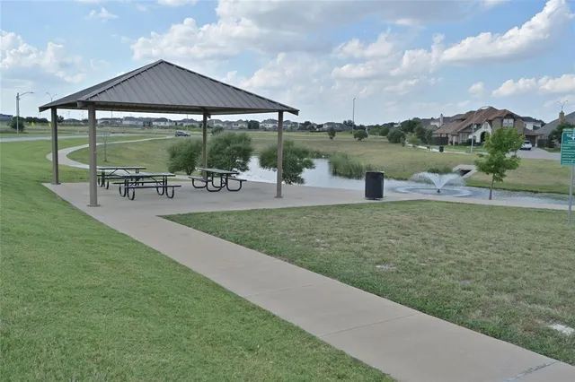 a view of a garden with an outdoor seating