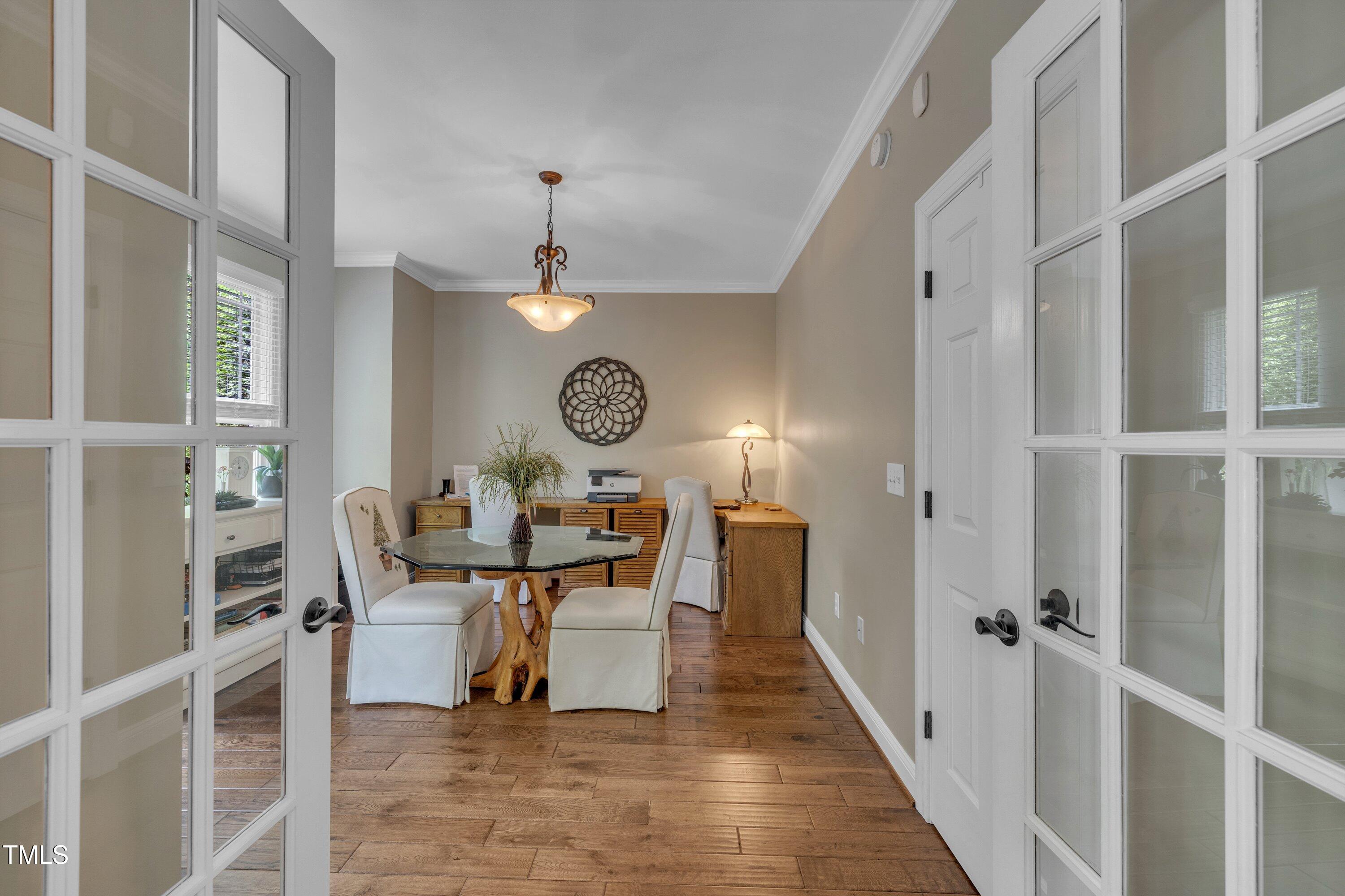 4802 Glenmist Court Raleigh, NC 27612 - Photo 17 of 52 a view of a dining room with furniture