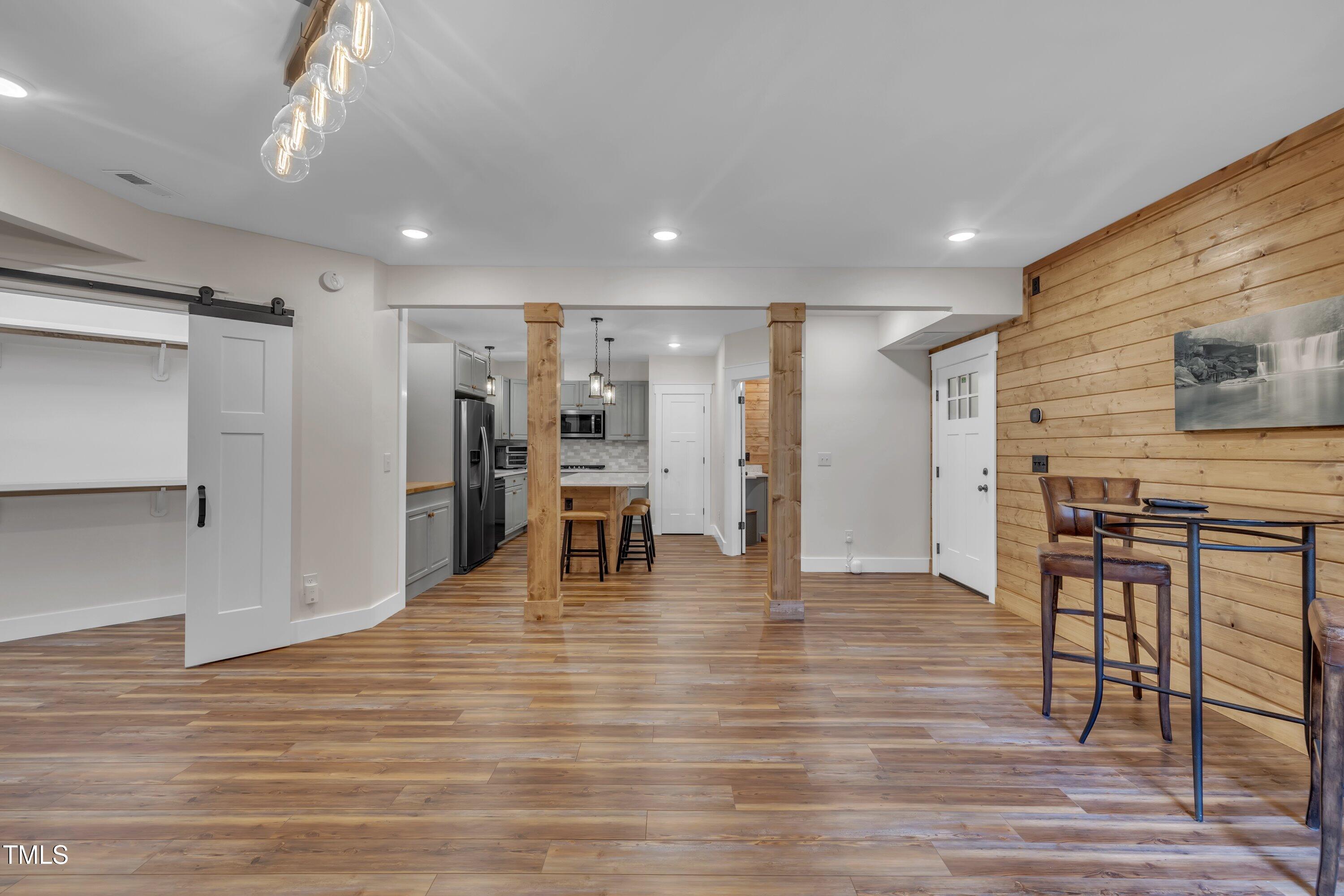 4802 Glenmist Court Raleigh, NC 27612 - Photo 39 of 52 a view of kitchen with furniture and wooden floor