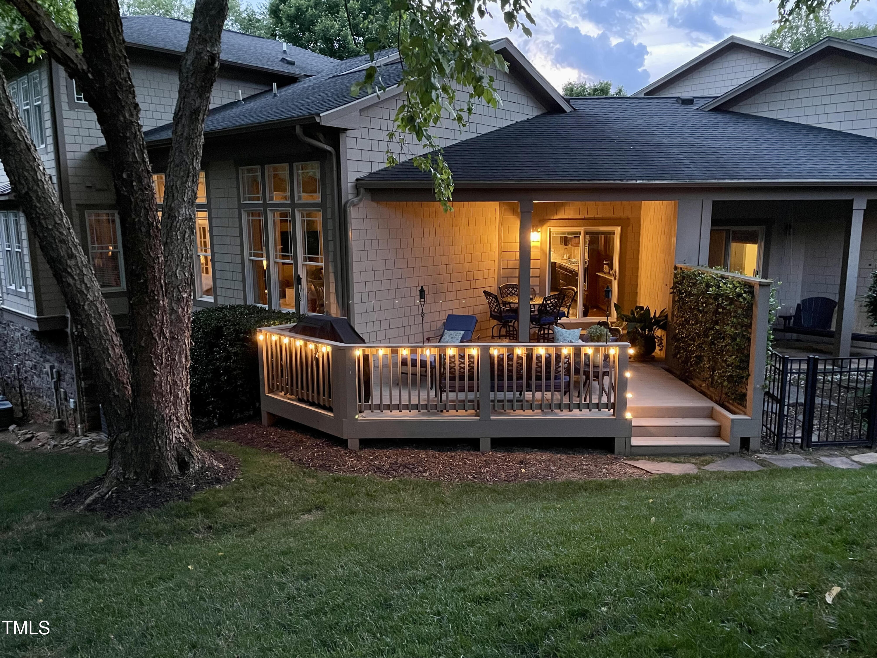 4802 Glenmist Court Raleigh, NC 27612 - Photo 5 of 52 a view of a house with a deck and a yard