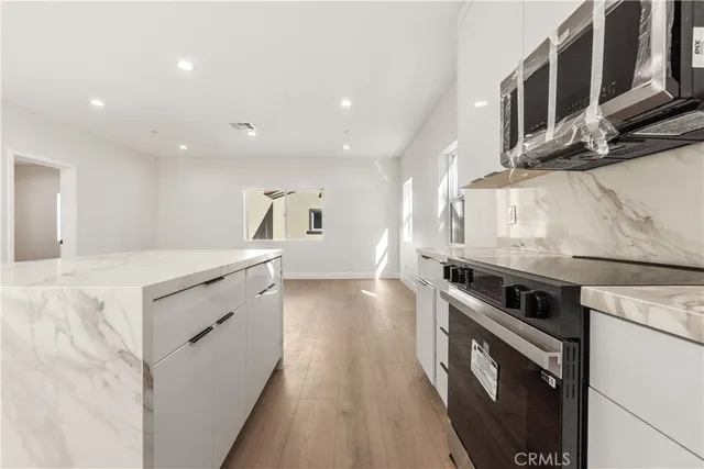 a kitchen with a stove and a sink