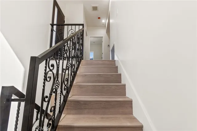 a view of staircase with white walls and white walls