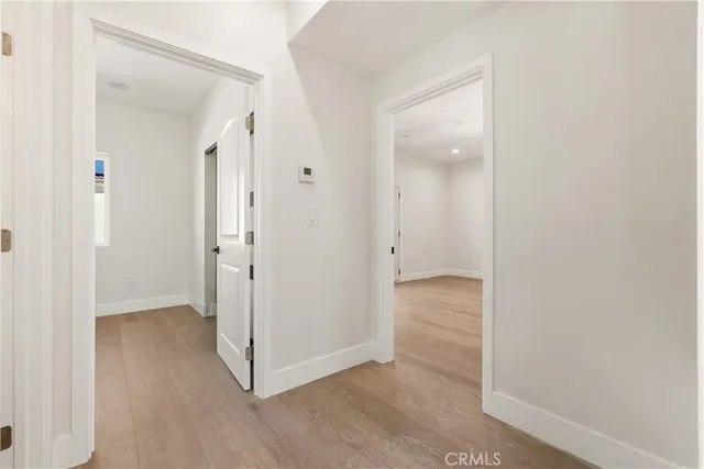 an empty room with wooden floor