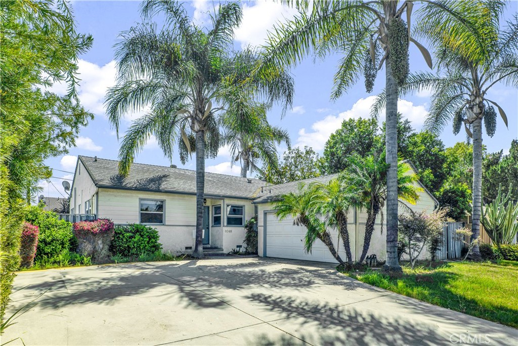 8048 Etiwanda Avenue Reseda, CA 91335 - Photo 1 of 16 a view of a yard with palm trees